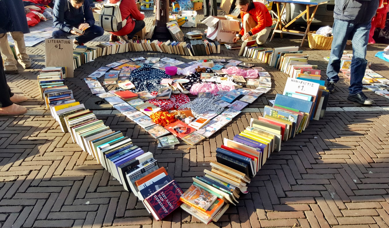 Books and clothing for sale at the Waterlooplein Flea Market in Amsterdam, Netherlands