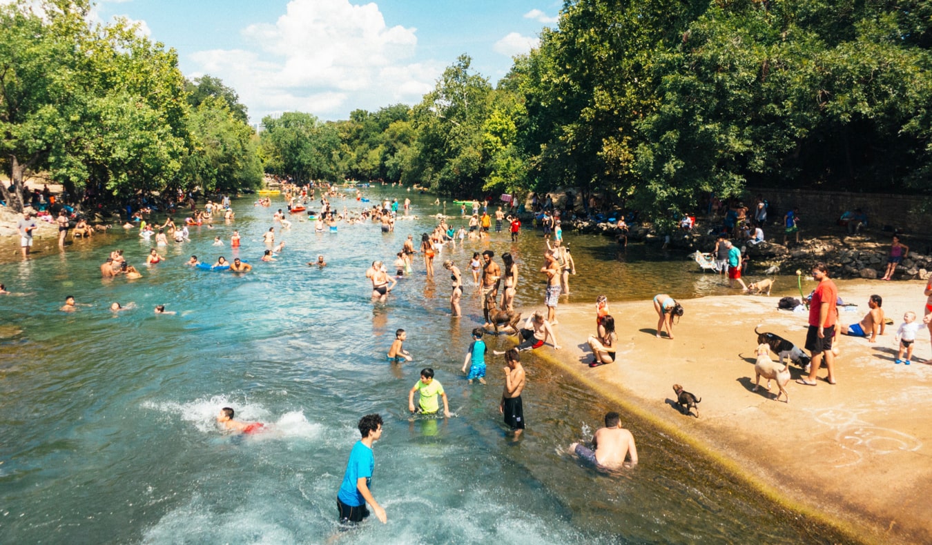 People swimming and having fun at Barton Springs in Austin, Texas