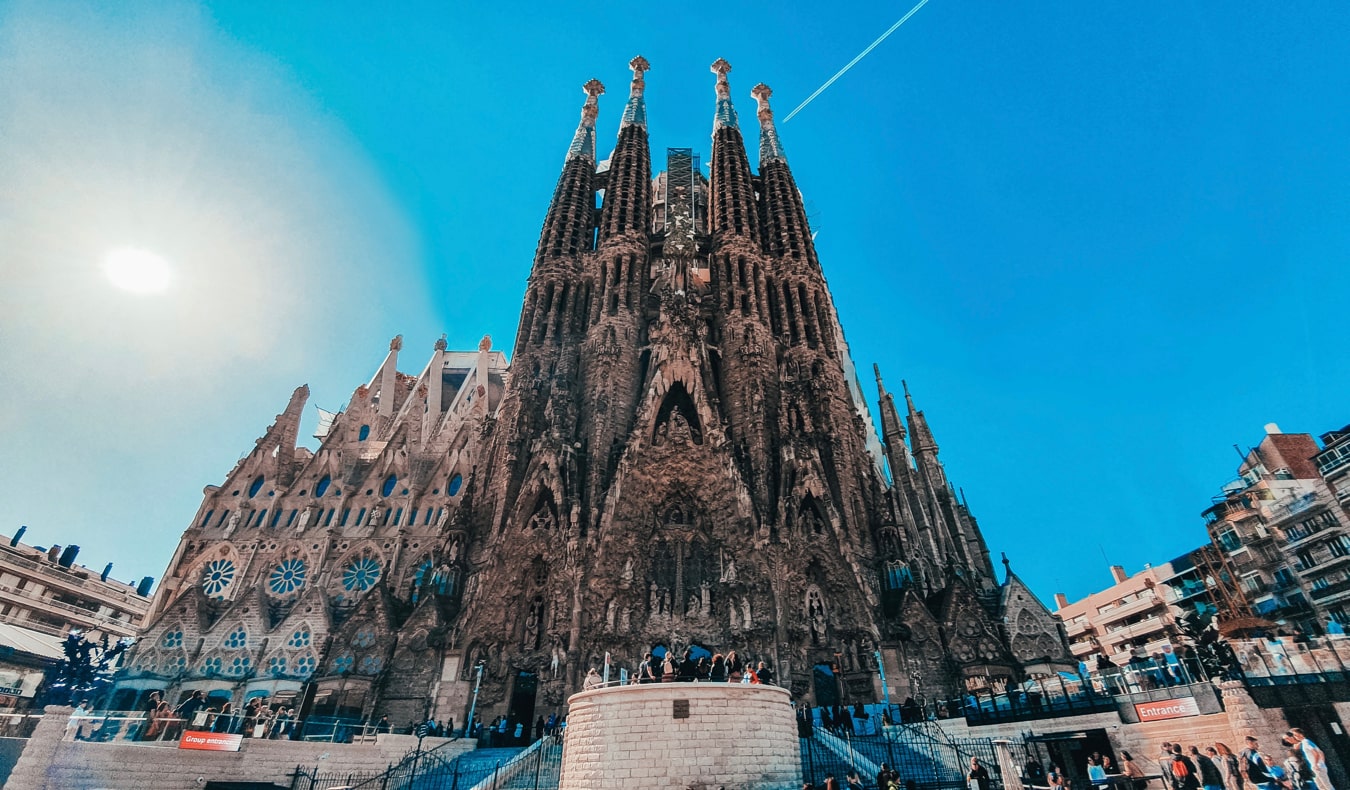 The famous Sagrada Familia cathedral as seen from below during a bright and sunny day in Spain