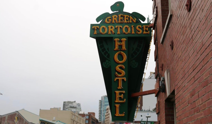 A sign outside of the Green Tortoise hostel in Seattle, Washington