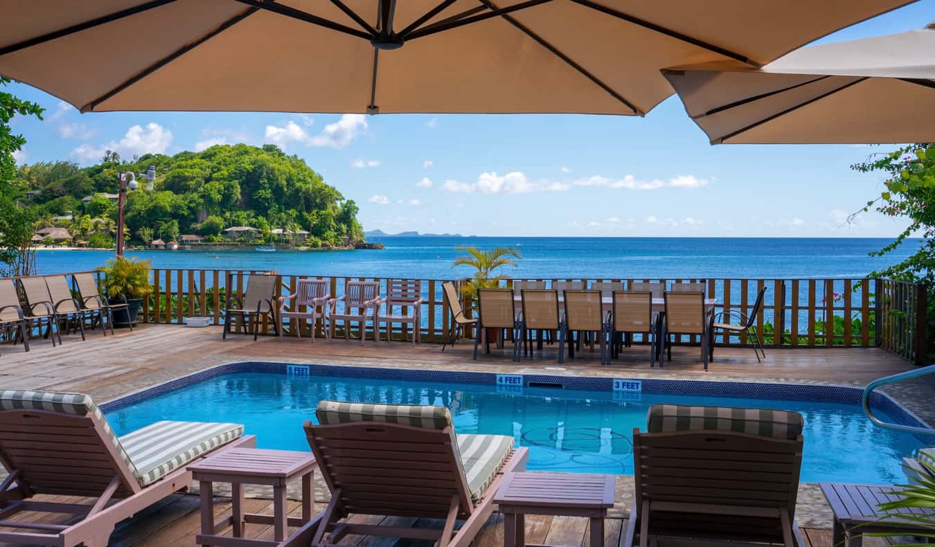 A swimming pool in a small resort by the ocean in the Caribbean