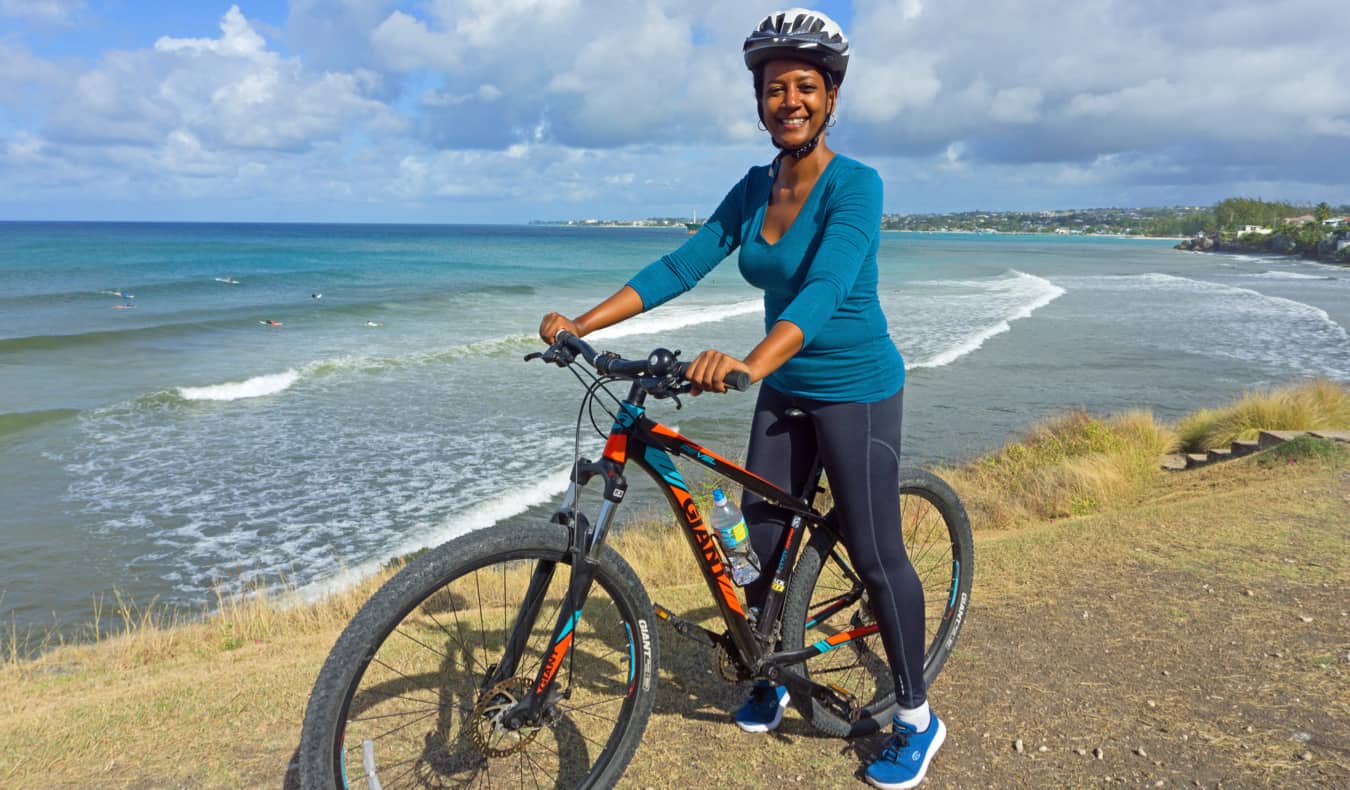 Lily Girma, a travel writer, cycling in the Caribbean