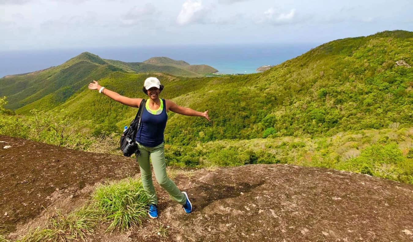 Lily Girma, a travel writer, hiking in the Caribbean