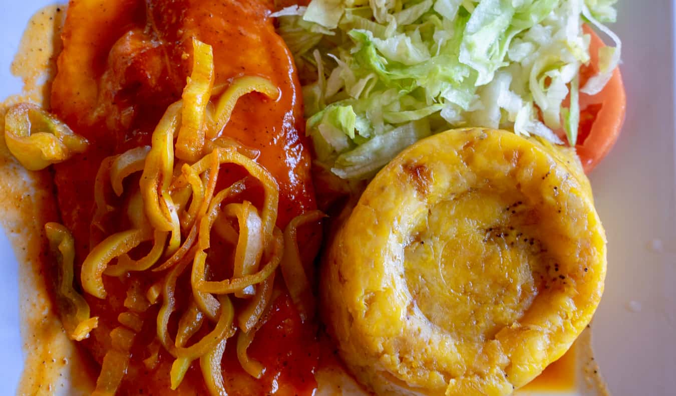 Fresh and delicious Caribbean food presented on a plate up close