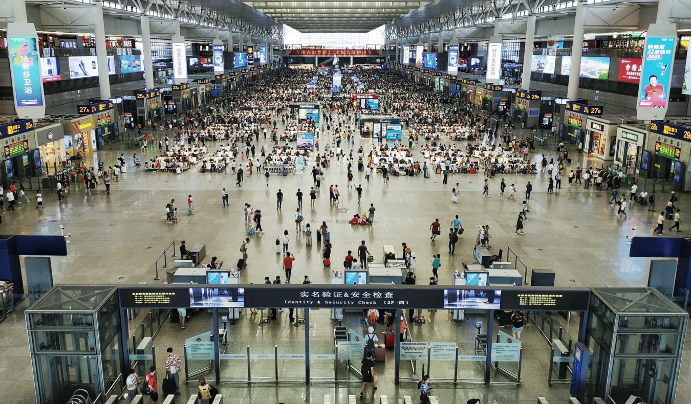 A busy airport terminal full of bustling travelers