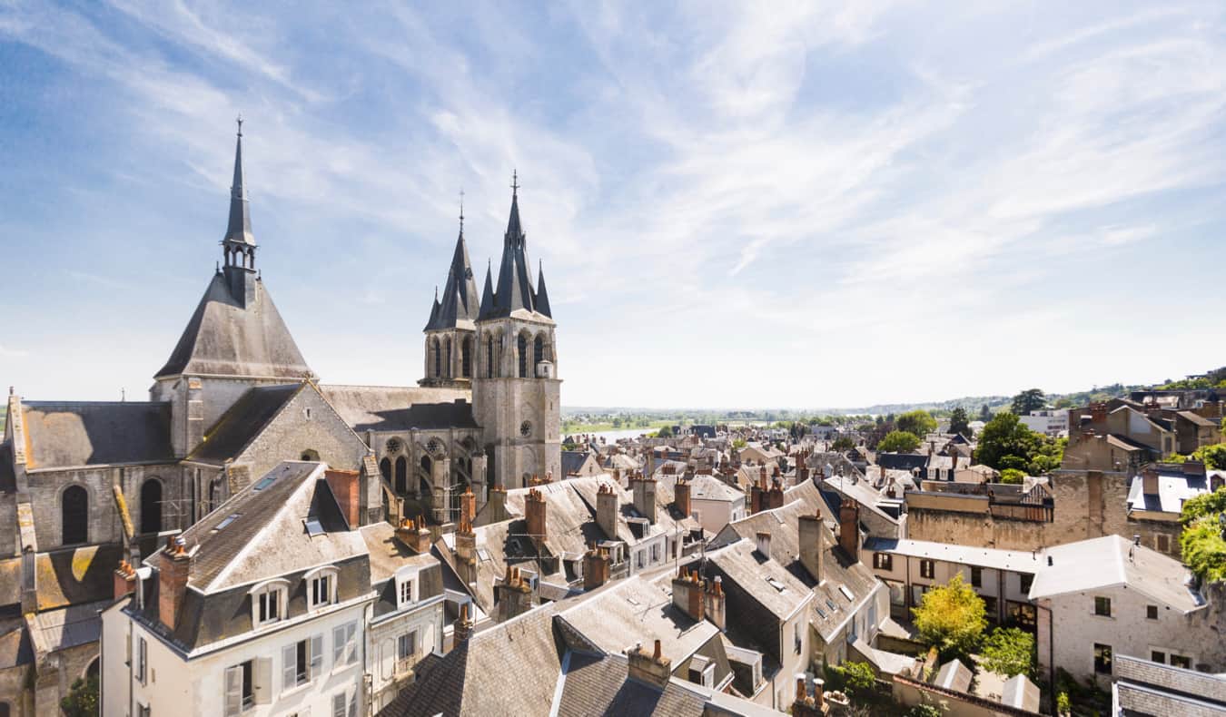 A massive, historic chateau in Blois, France during the summer