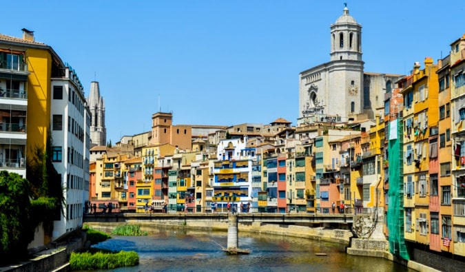 The colorful buildings of Girona, Spain overlooking a river