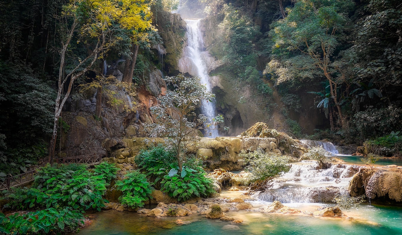 A picturesque waterfall surrounded by jungle in Laos