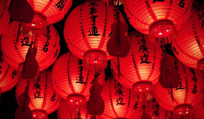 Red lanterns at night with Chinese characters on them