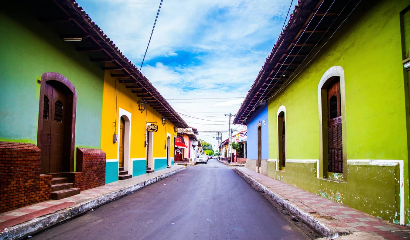 Colorful buildings along a narrow street in Leon, Nicaragua