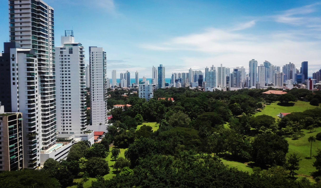 The towering skyline of Panama City surrounded by its lush green parks