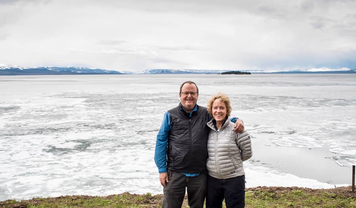 Tom and Kristin, two retired seniors posing near the ocean