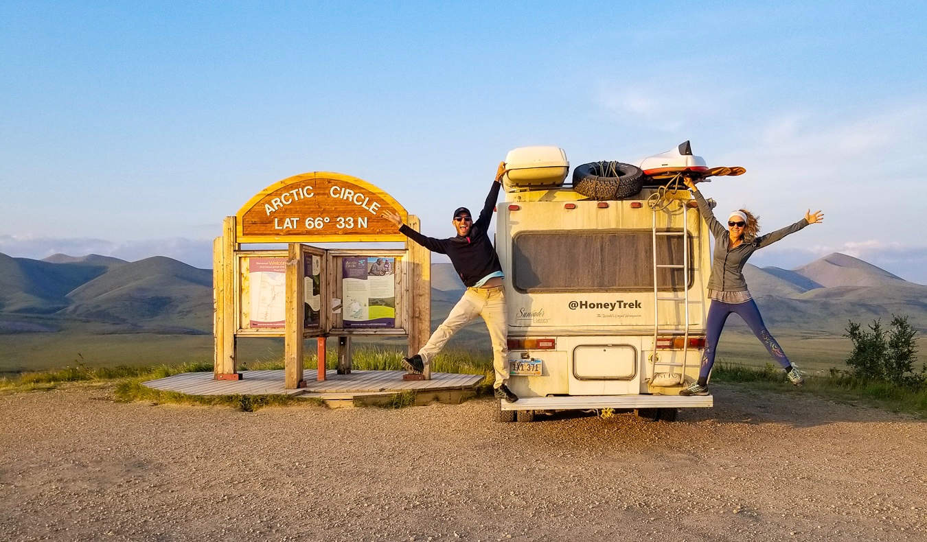 Mike and Anne from HoneyTrek posing in the arctic circle