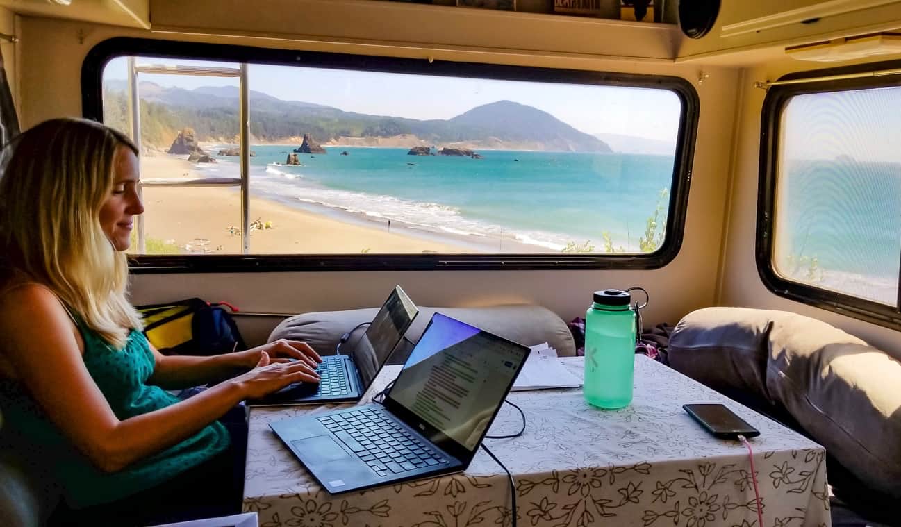 Anne from HoneyTrek working on a laptop in her RV