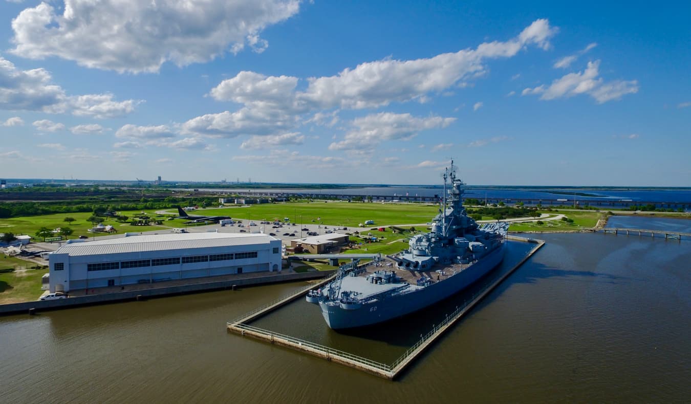 A massive aircraft carrier docked near Mobile, Alabama