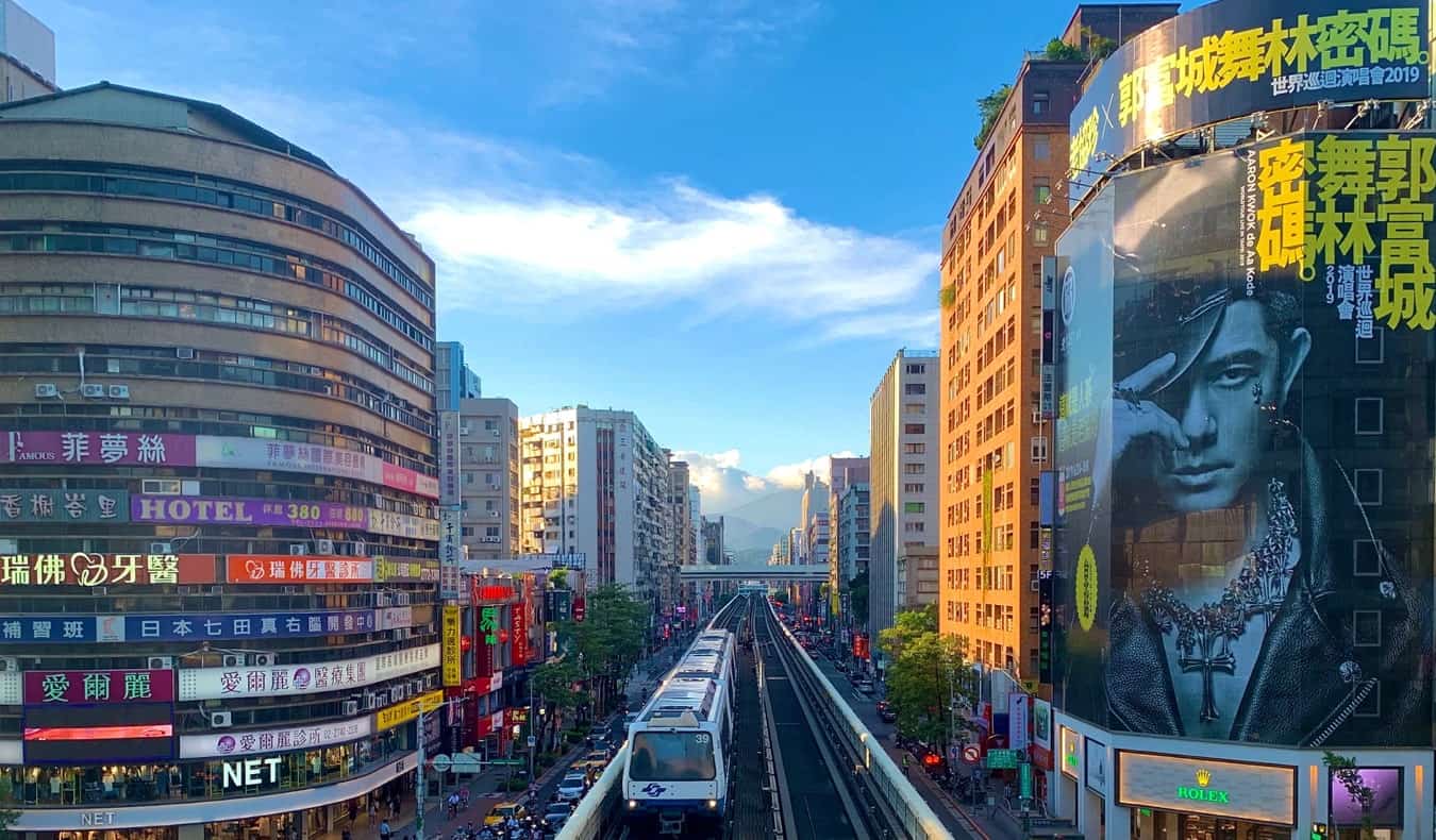 The busy downtown and tall buildings of Taipei, Taiwan on a sunny, warm day