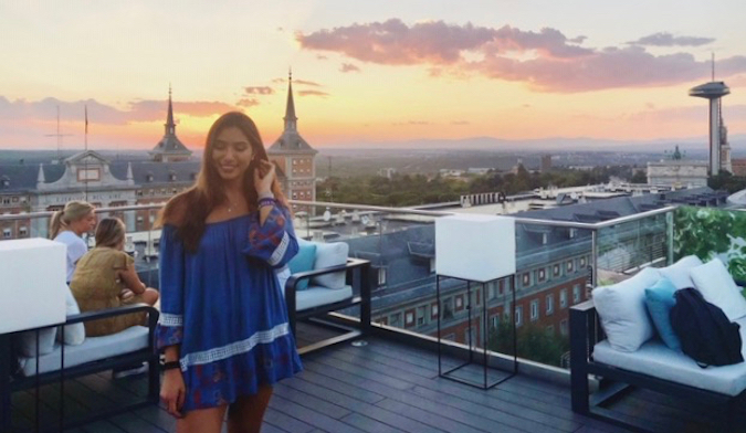 Natasha, a solo female traveler and English teacher posing at sunset