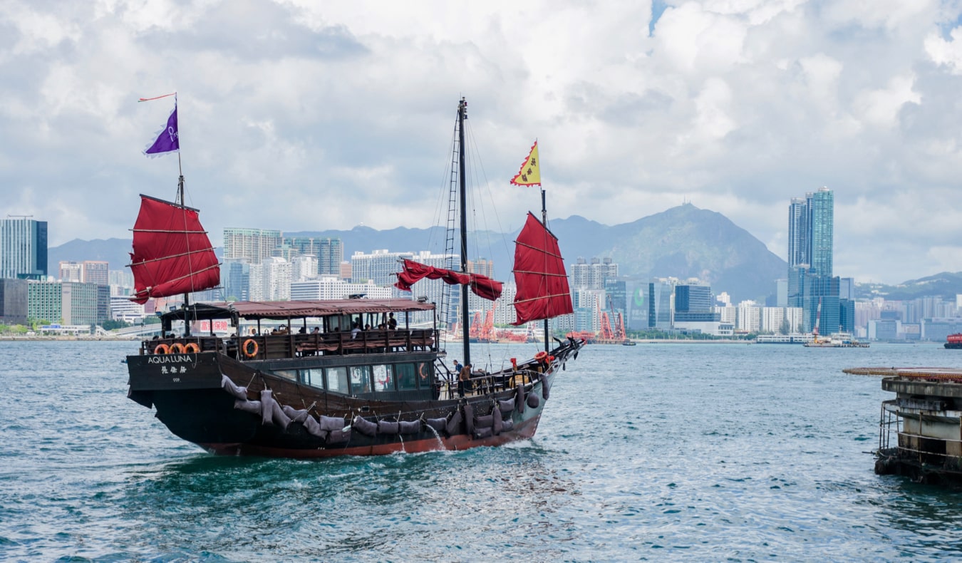 The famous Hong Kong junk boats sailing on the waters near Hong Kong