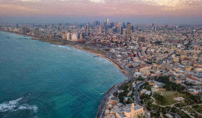 A aerial view of Tel Aviv in Israel during a colorful sunset