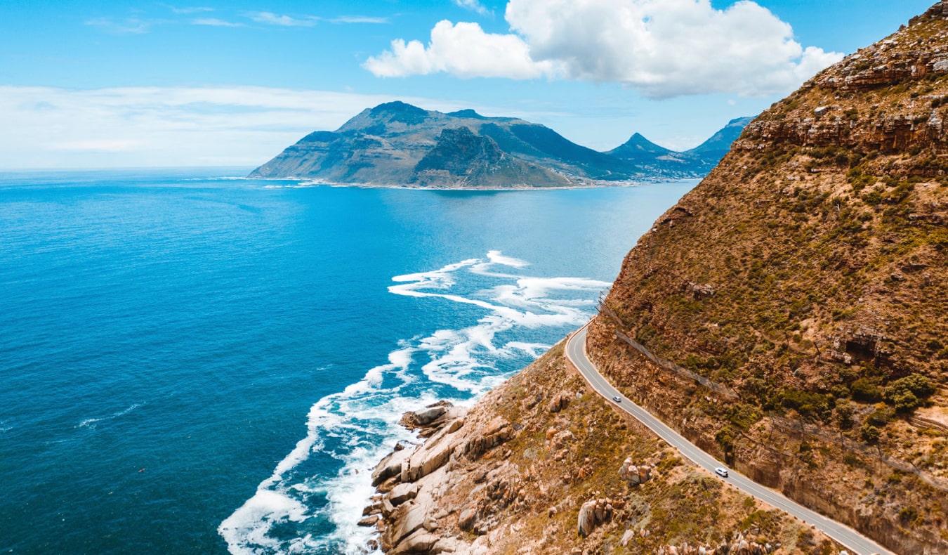 A car on the winding coastal highway in South Africa