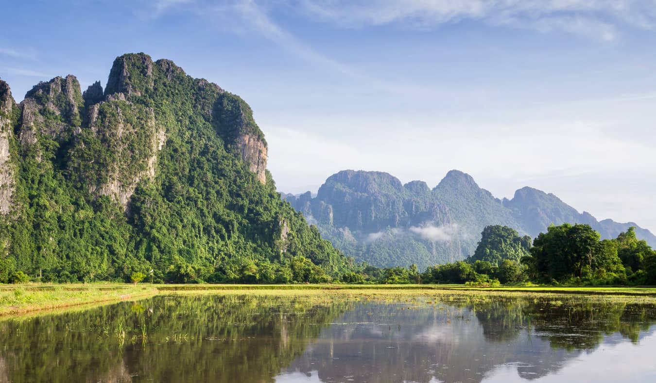 A river in Vang Vieng, Laos with mountains in the distance