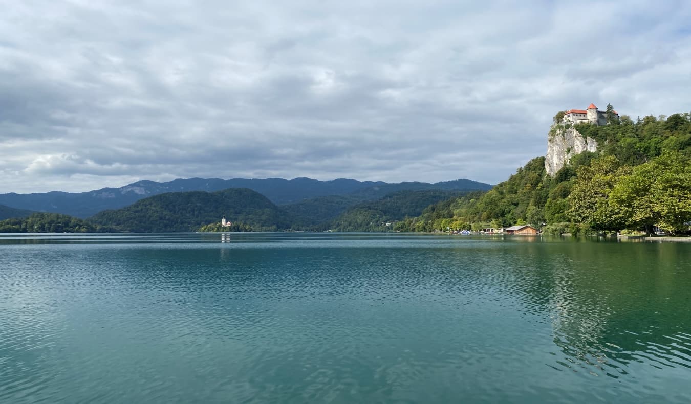 view over Lake Bled in Slovenia with castles and mountains in the background