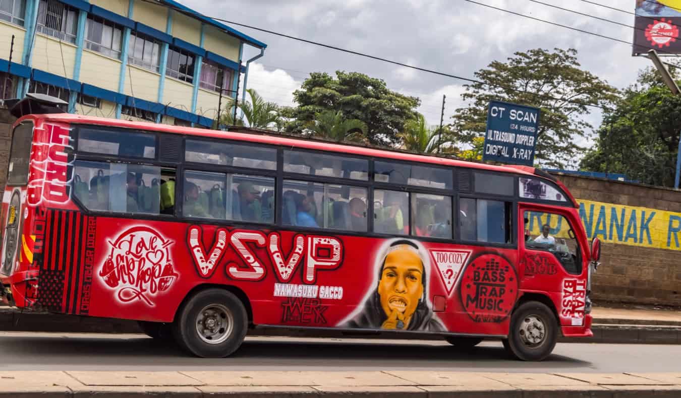 A large public bus on the road in Africa