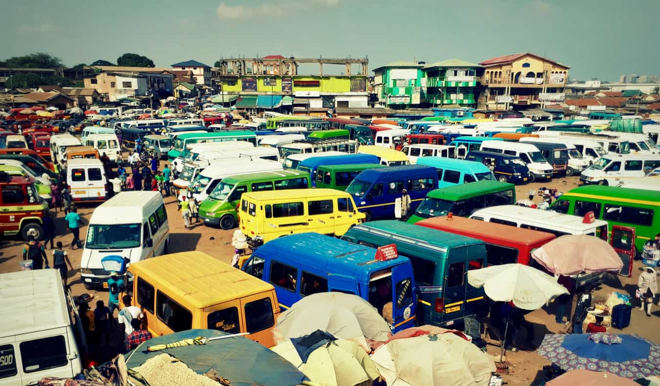 A parking lot full of minibuses in Ghana, Africa