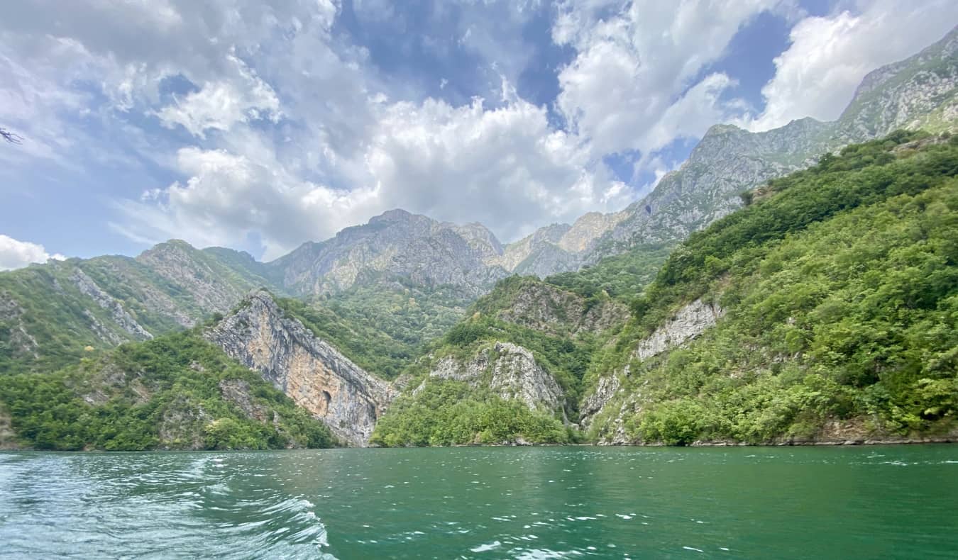 Clear, stunning water near the lush mountains of Albania