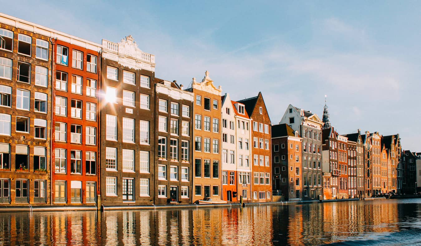 Row of townhomes in Amsterdam, Netherlands along a historic canal