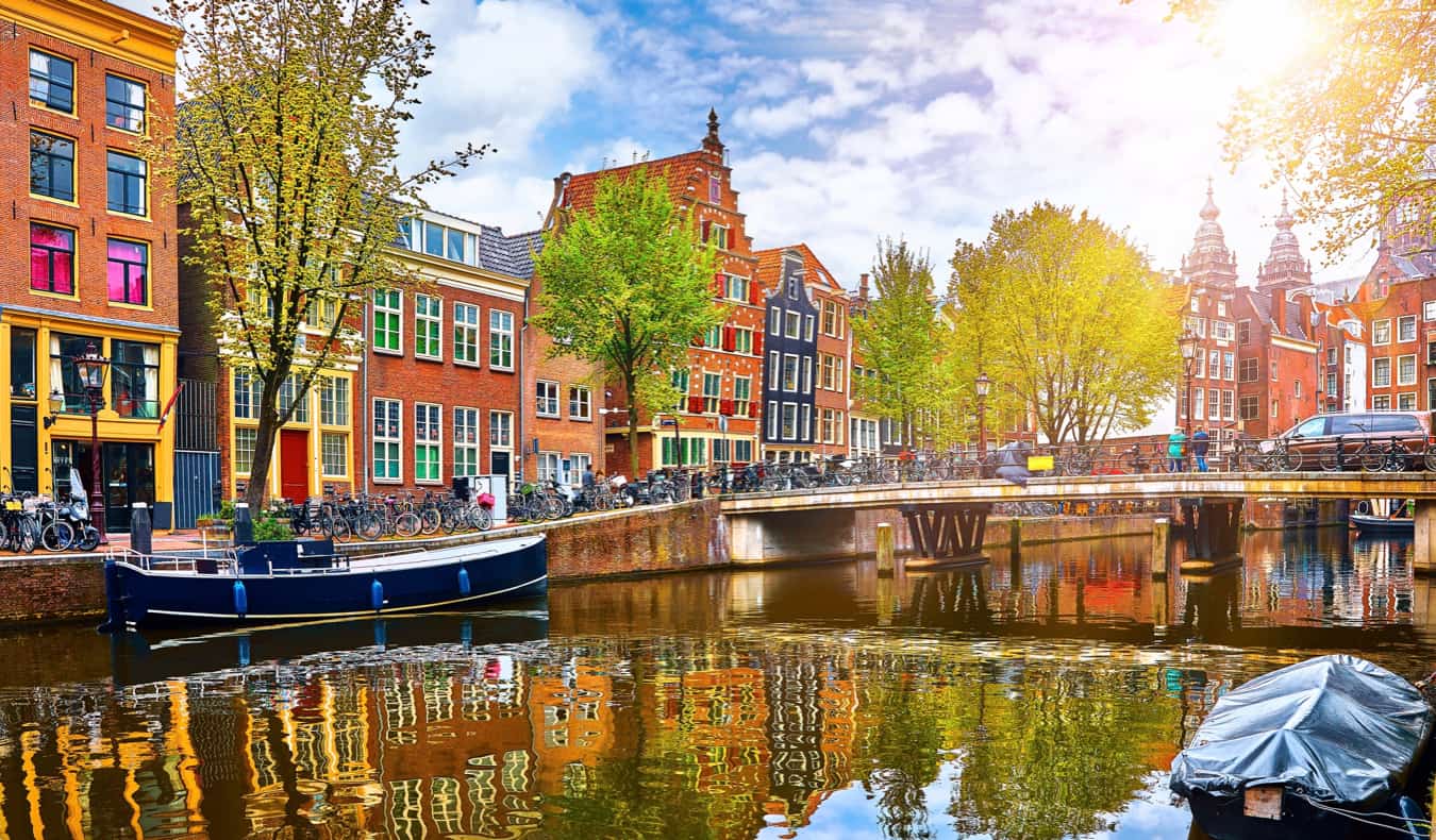 The colorful canal houses along the water in Amsterdam, Netherlands