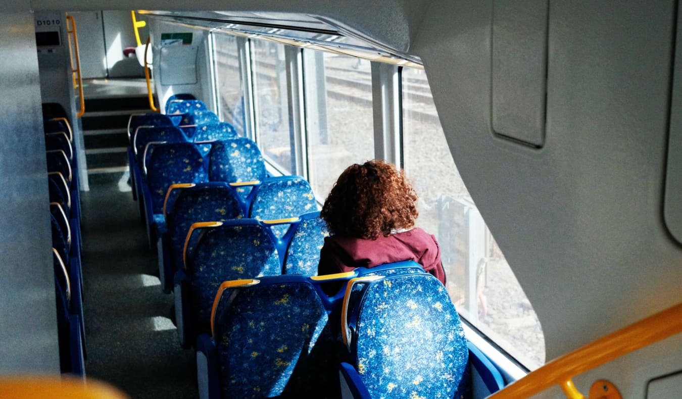 A woman riding public transit in Sydney, Australia