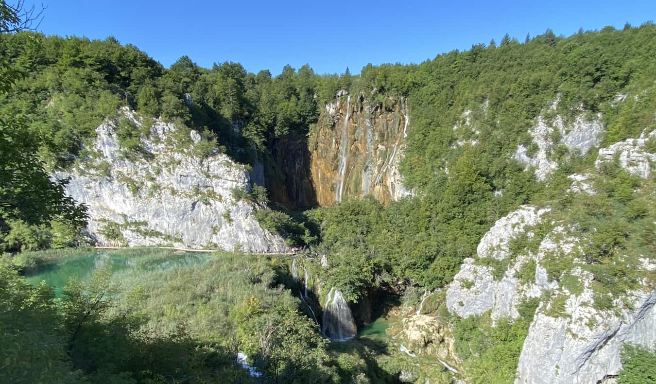 The lush greenery of Croatia surrounded bu rugged hills and clear water