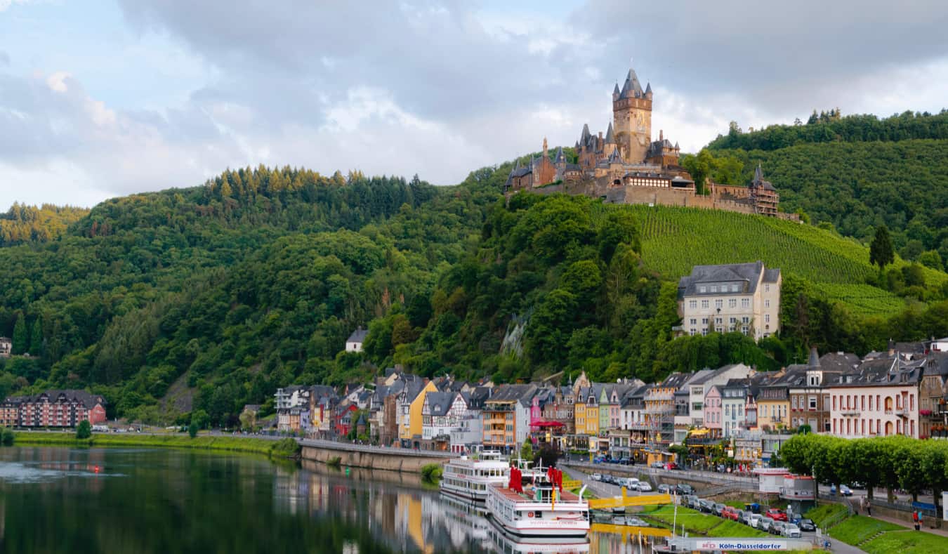 A scenic vista of a castle overlooking a small village in Germany