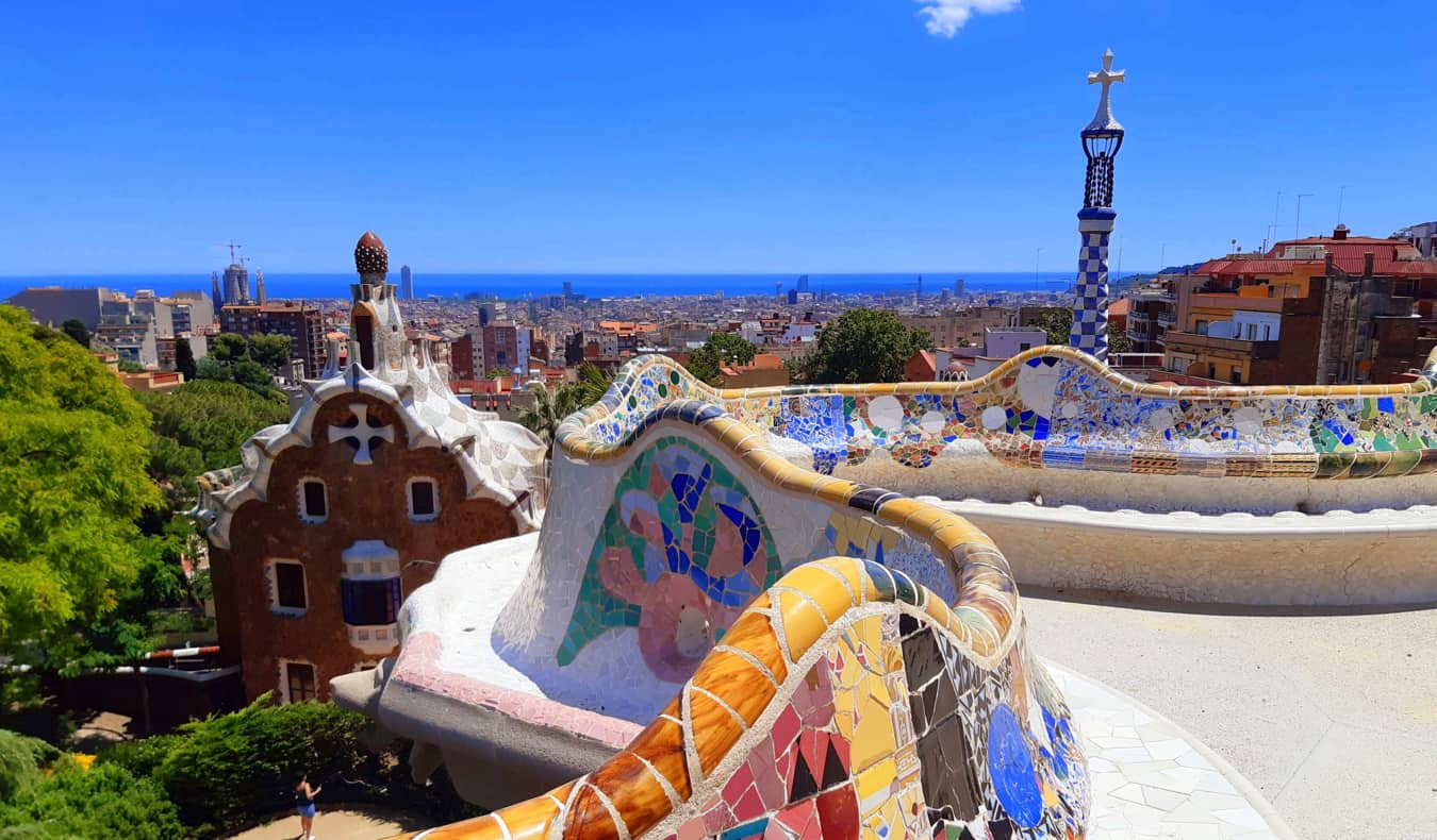People enjoying Gaudi's famous Park Guell in Barcelona, Spain on a sunny day