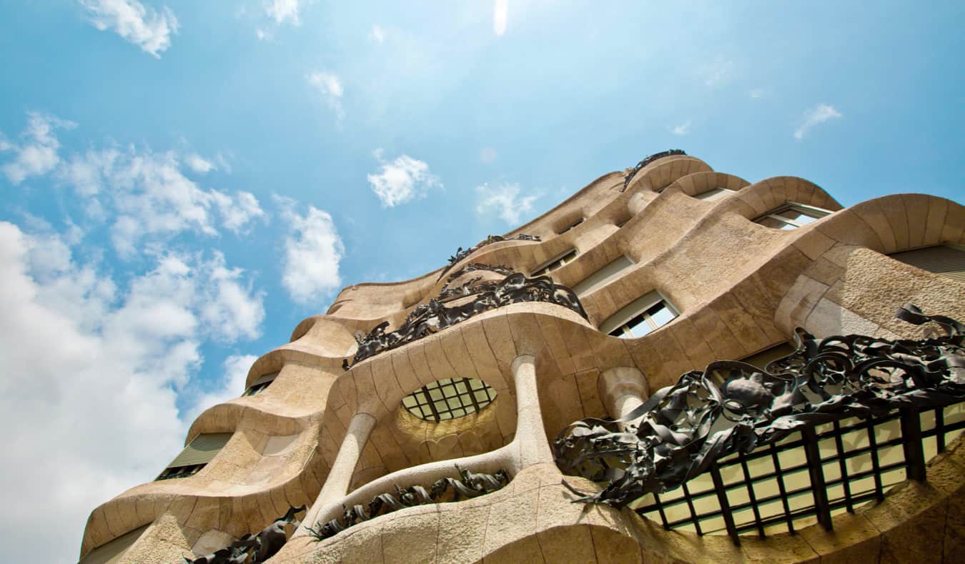 The towering white exterior of Gaudi's Casa Mila in Barcelona, Spain
