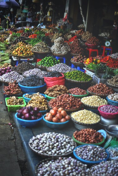 Produce and food goods piled in bowls at Hanoi market