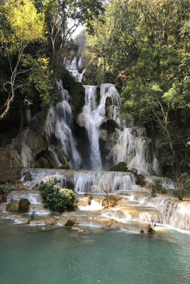 Kuang Si Falls surrounded by trees