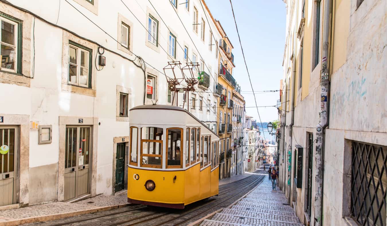 A tram climbing a steep hill in the Bairro Alto district of Lisbon, Portugal