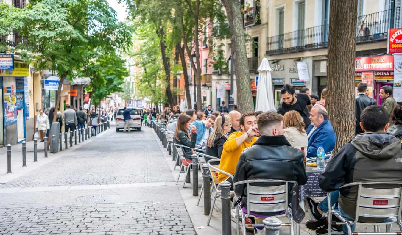 People lounging at a cafe in Lavapiés in Madrid, Spain