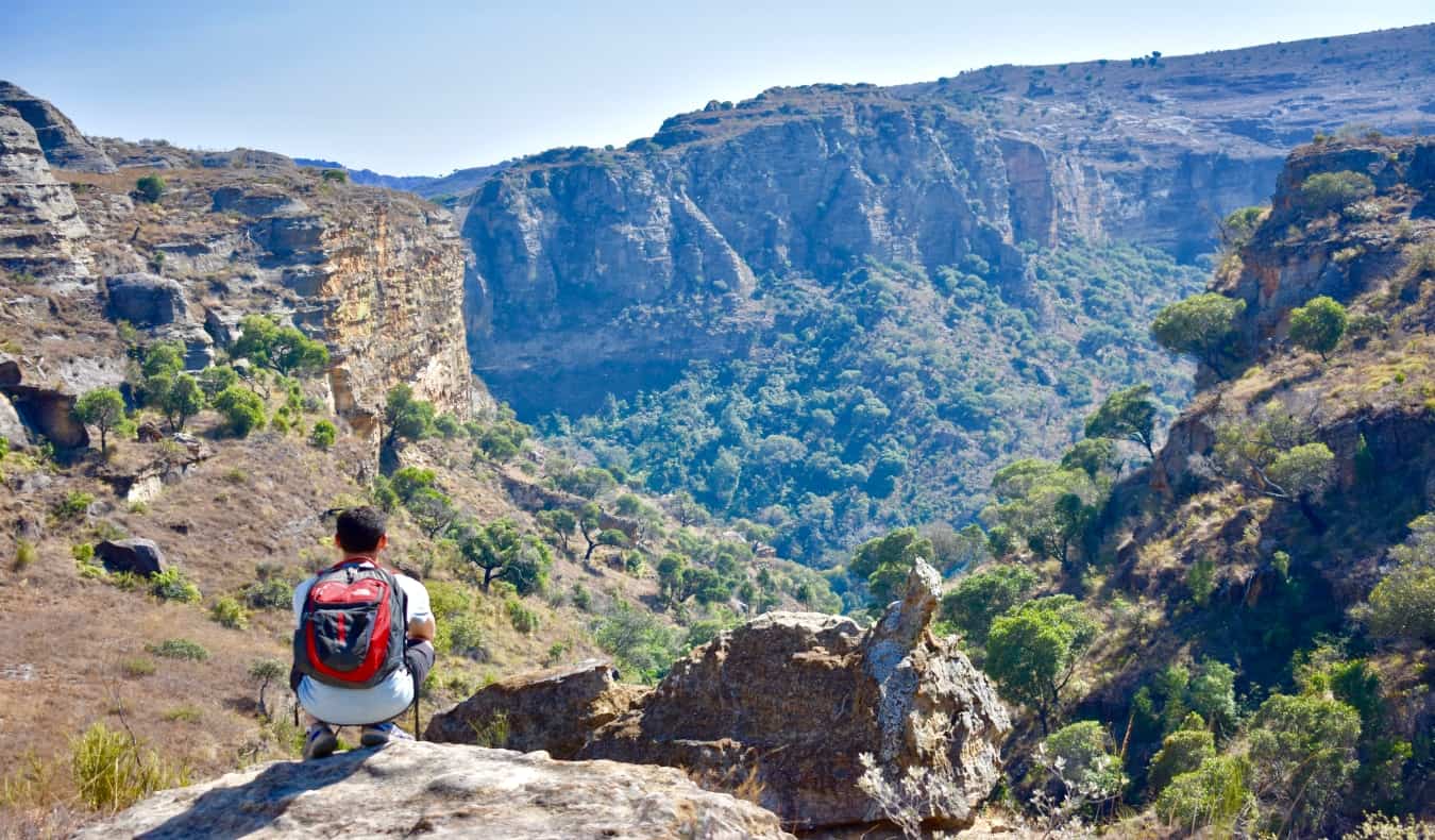 Nomadic Matt looking out over gorge in Africa
