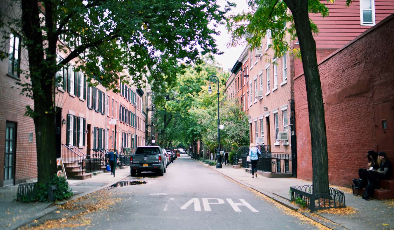 Winding street lined with red brick buildings in Greenwich Village in New York City