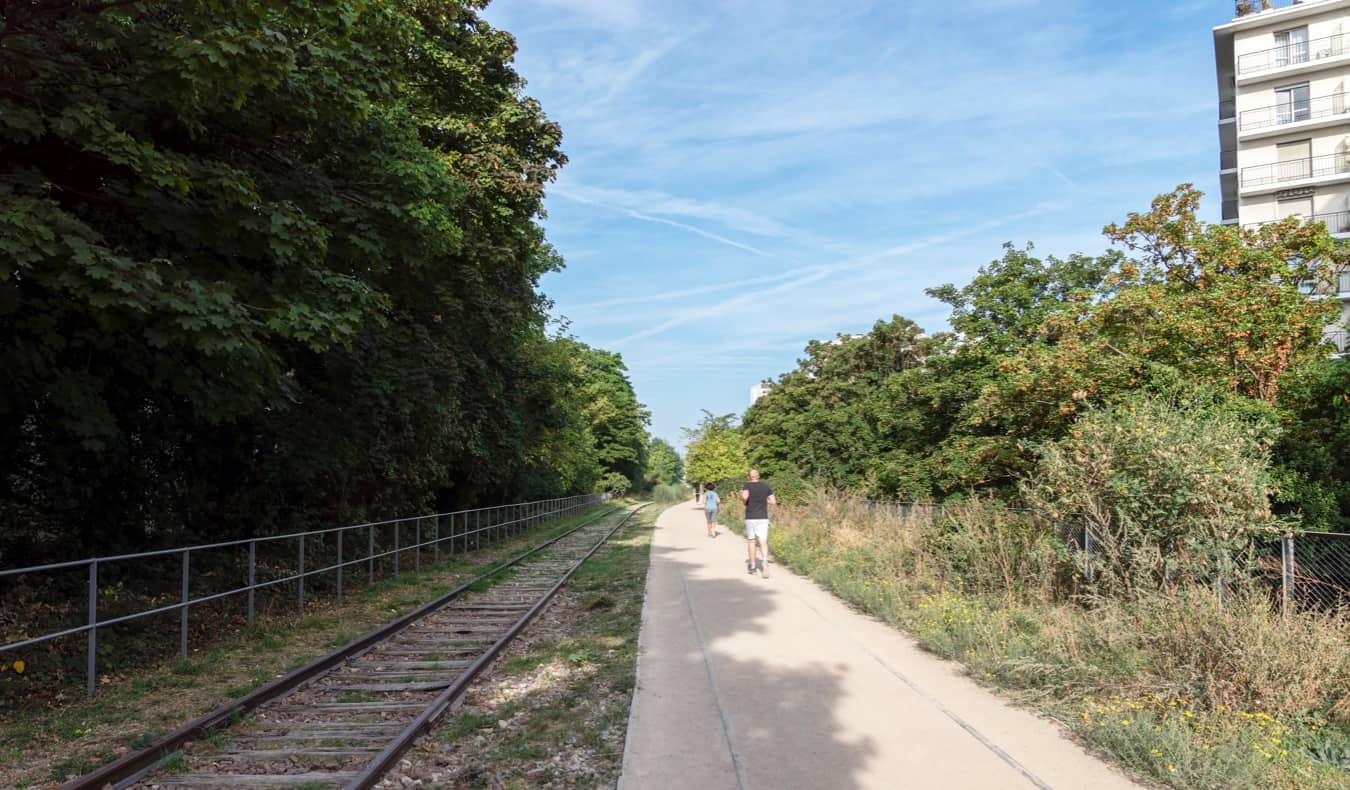 People jogging near the old railway around Paris, France