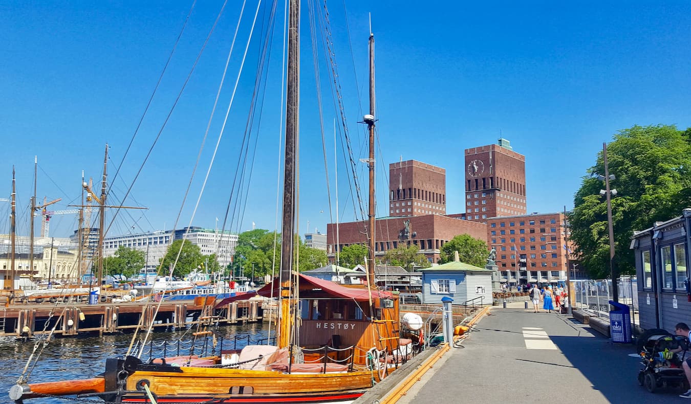 The red City Hall building near the harbor in Oslo, Norway