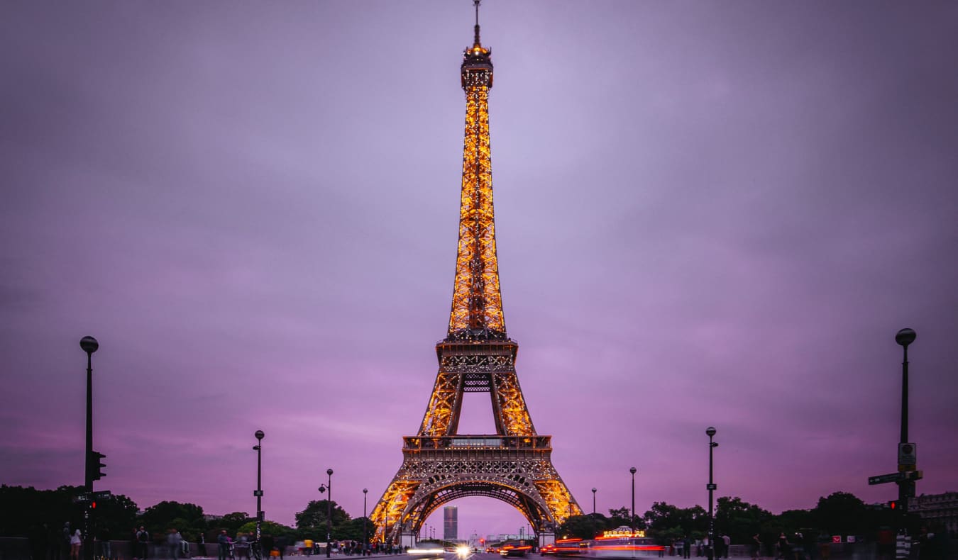 Eiffel Tower lit up at night in Paris