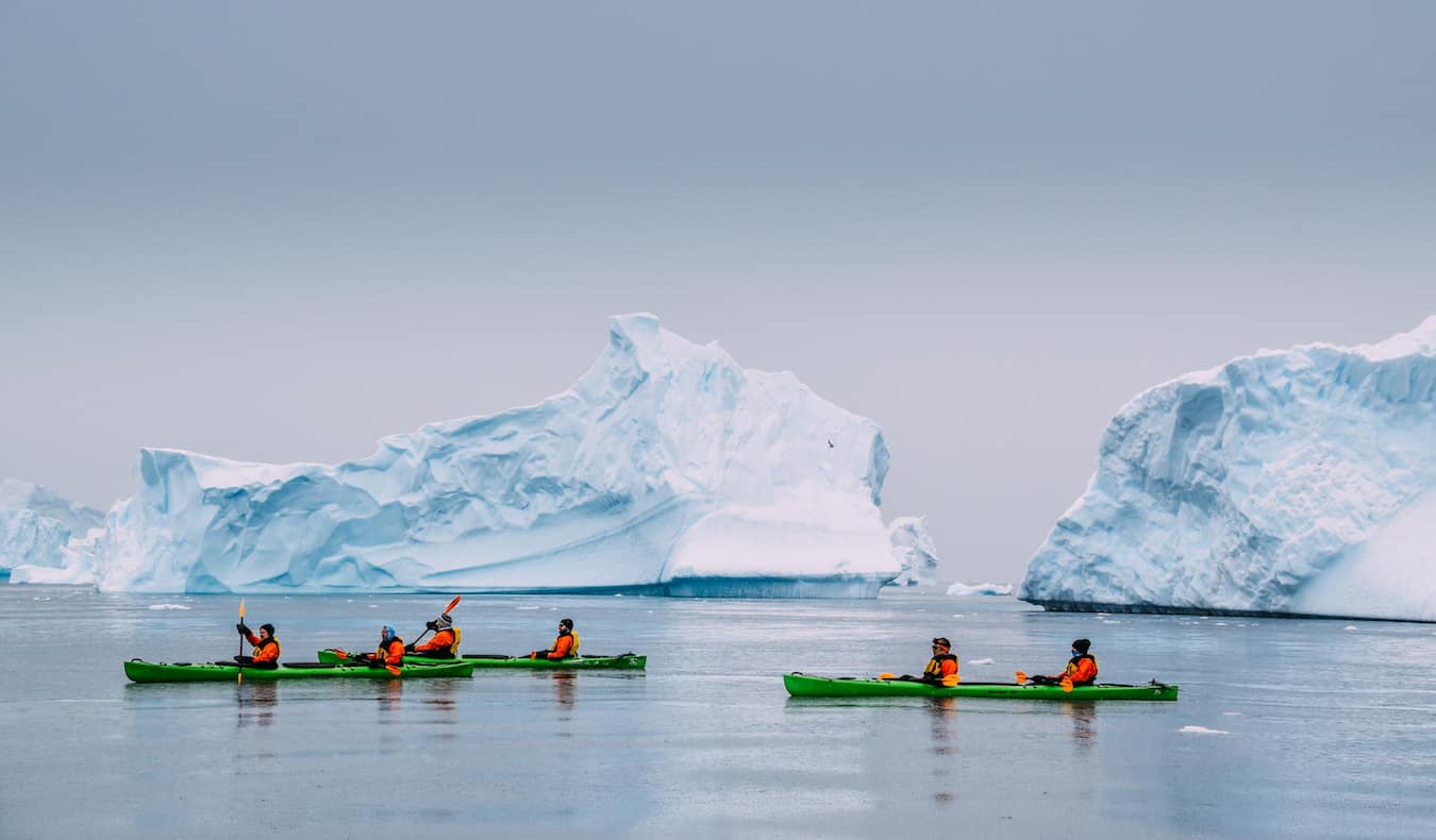 Rax, a solo digital nomad, kayaking in Iceland