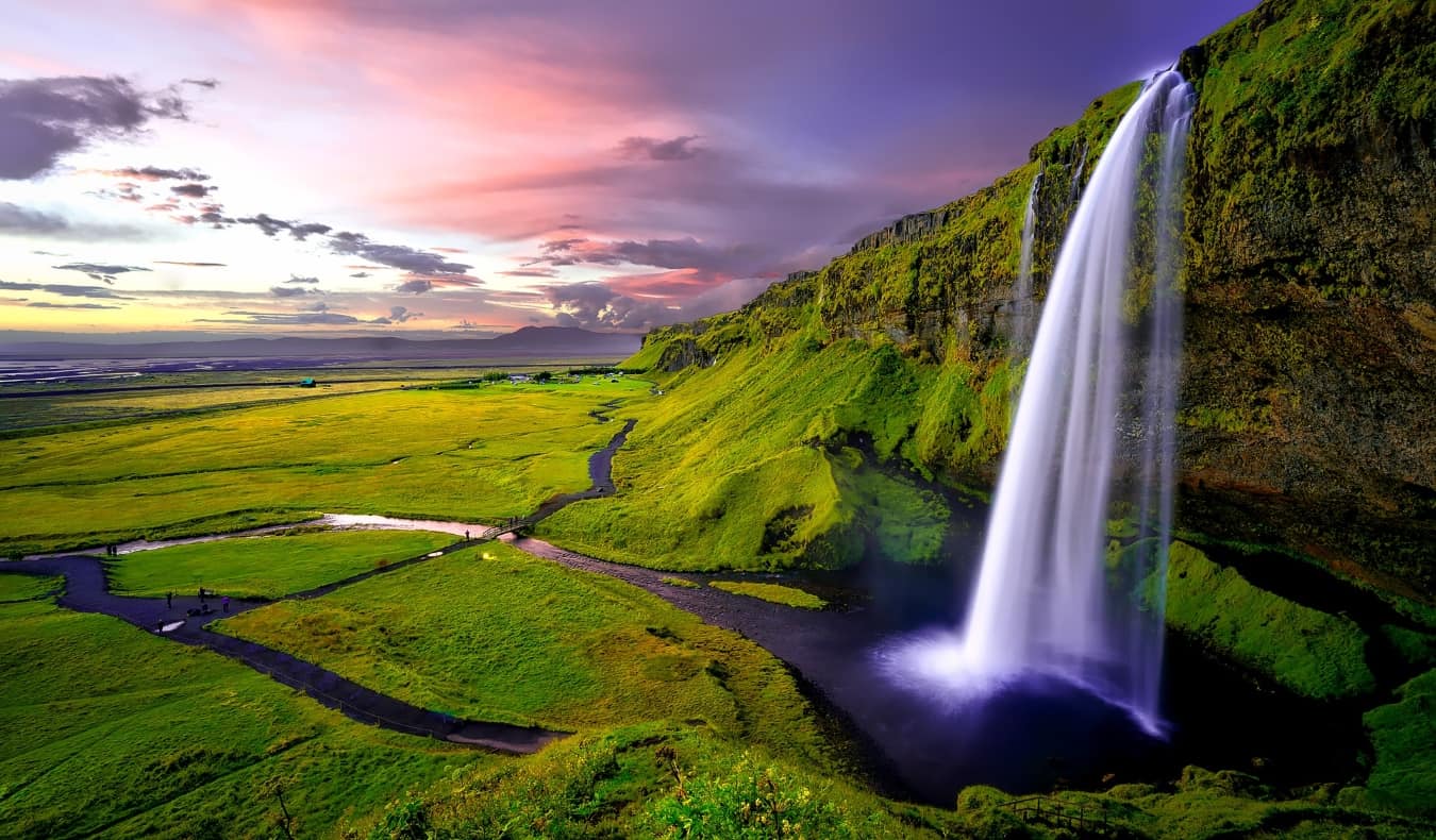 Icelandic waterfall and green landscape