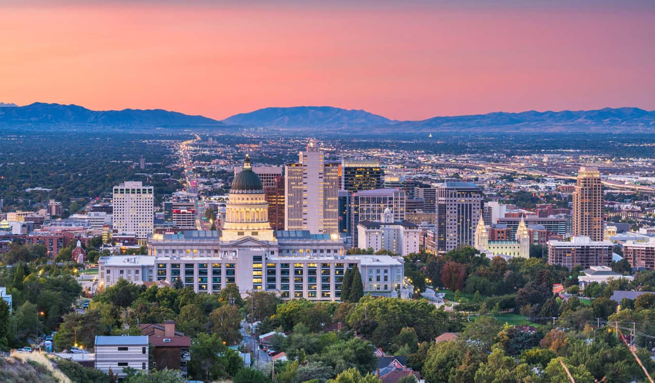 A colorful sunset over Salt Lake City, Utah with mountains in the background