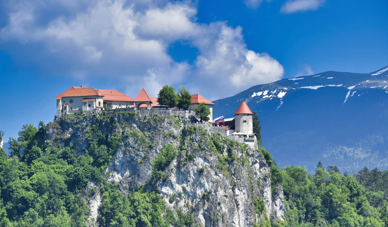 The towering Lake Bled castle in Slovenia perched on a tall cliff