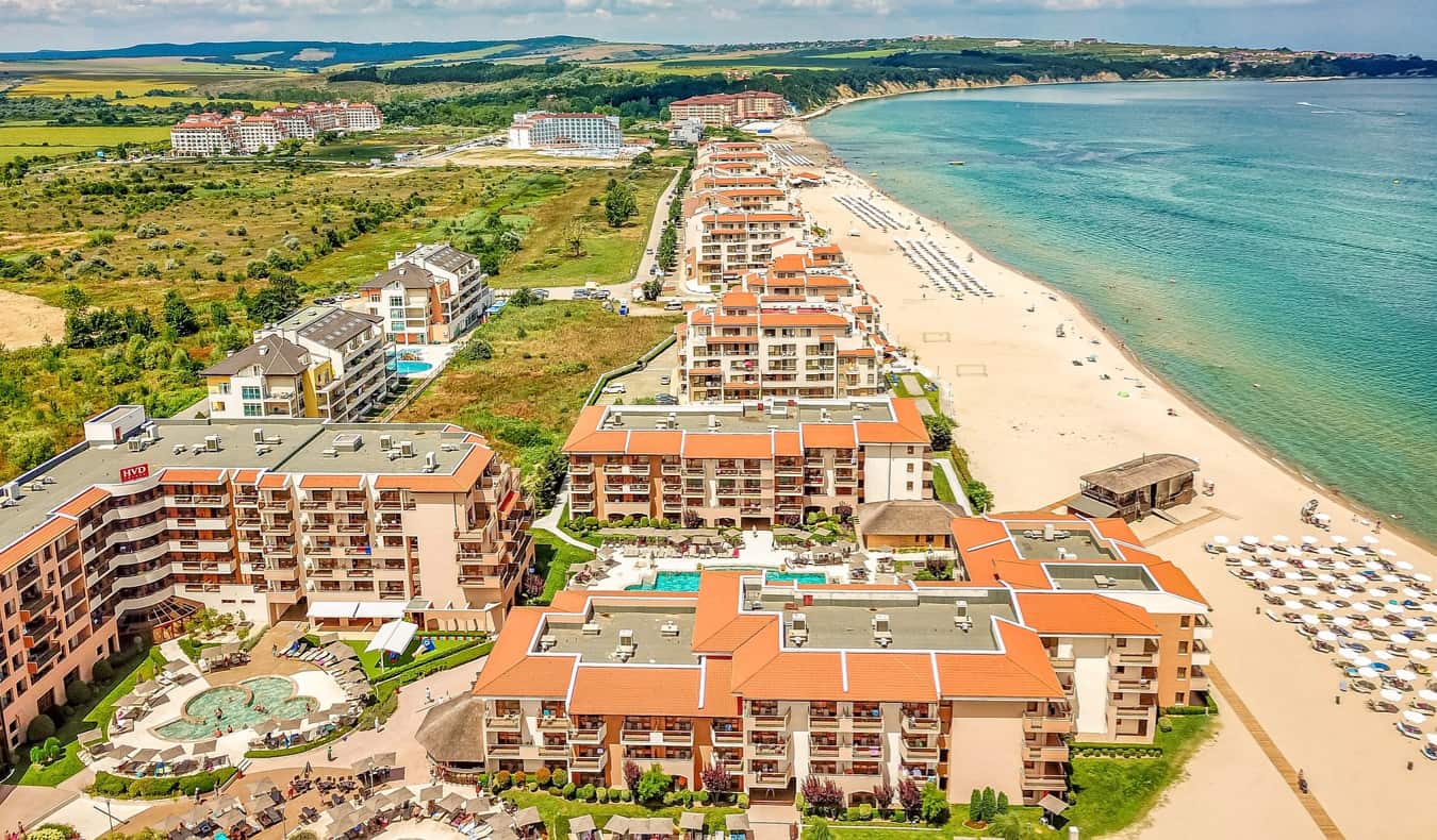 The crowded beach and waters of Sunny Beach in Bulgaria on a bright summer day